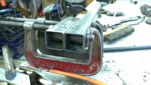 DIY - Workbench. Clamping the cylindrical tube inserts ready for welding. The jig is used to align the inserts.