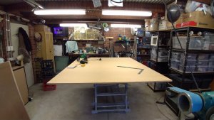 DIY - Workbench. A very large sheet of MDF to make the 2 shelves under the bench.