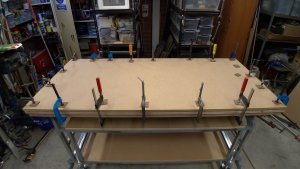 DIY - Workbench. Laminating Hardboard (Masonite) to both sides of the bench top.